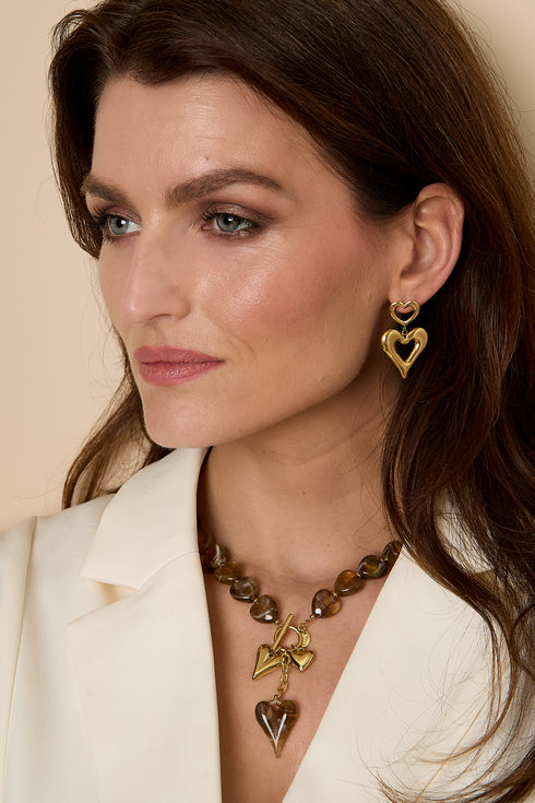 Bead necklace with hanging heart charms