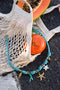 Rope chain with knots and starfish charms