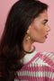 Oval hoop earrings with sun and bead charms