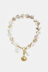 Necklace with shells, sea charms and gold shell charm