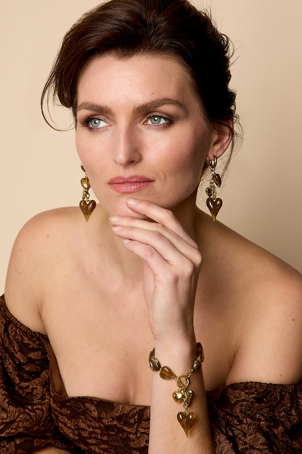 Beaded bracelet with hanging heart charms